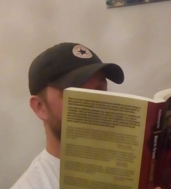 Picture of Adam reading a book